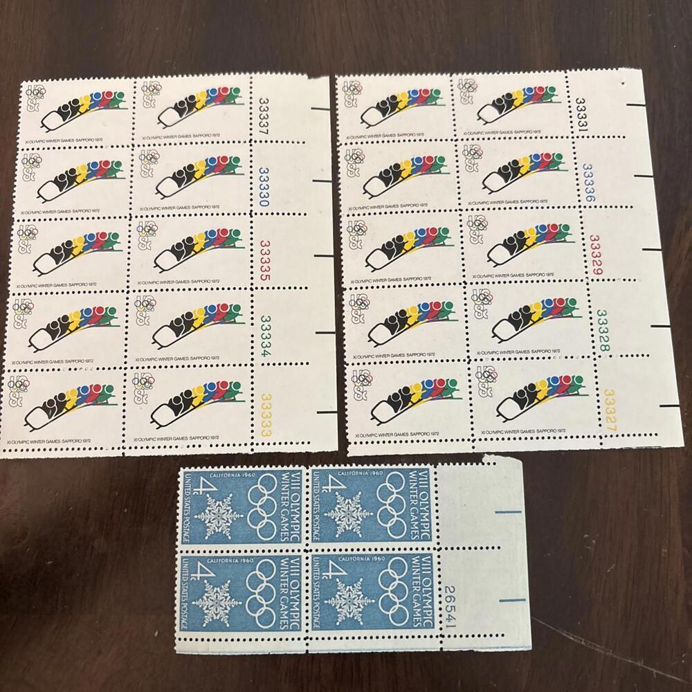 Lot of vintage U.S. postage stamps celebrating the Olympic Winter Games.